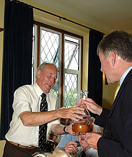 Roger Parsons presenting Johnny Bathurst with a decanter